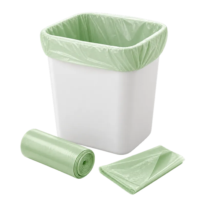 Pale green compostable bin liner fitted to a small bin with a matching roll
